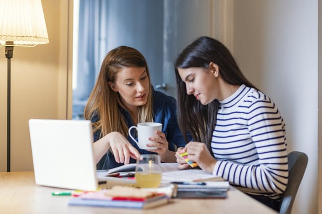 mom and teen daughter do homework ValSzh.width .jpg