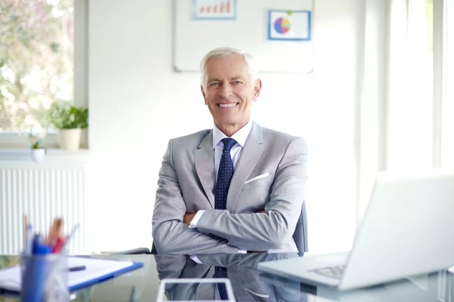 older man suit smiling gettyimages .jpg