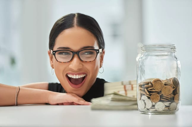 getty big smile jar of coins and cash millennial.jpg