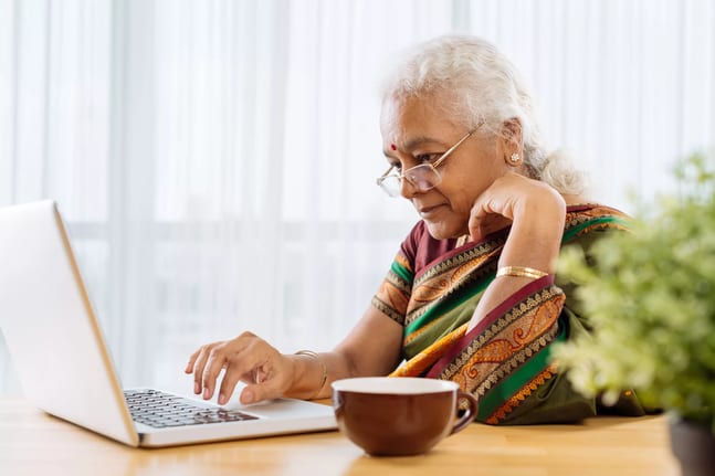 serious senior staring at laptop.jpg