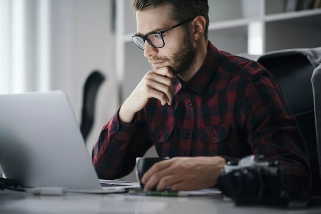 man s at desk serious gettyimages .jpg