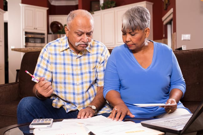 two people looking at documents bNJjmb