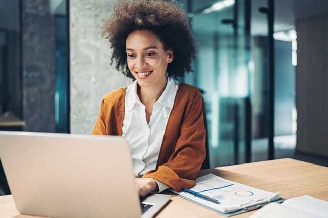 woman s smiling laptop gettyimages