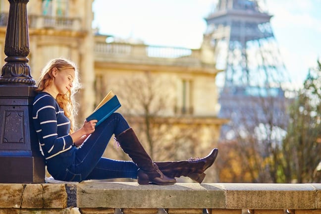 Woman reading book in Paris lxLNTg.width .jpg