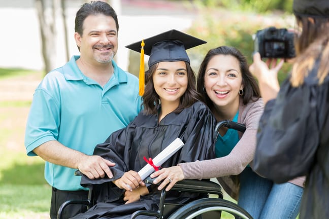proud parents with college graduate