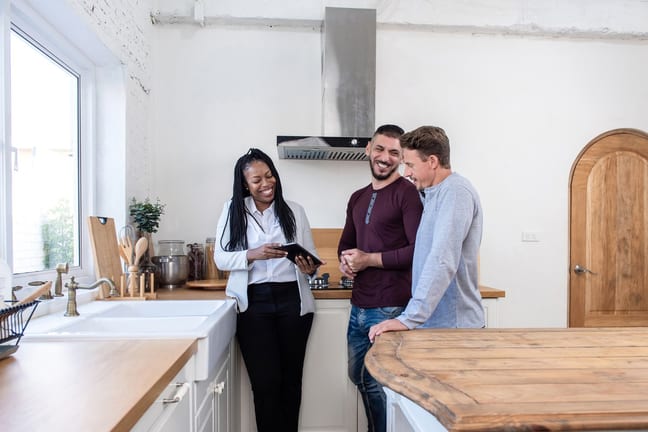 realtor showing couple new home.width