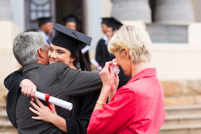 Female college grad hugging dad XOFFTxD.width .jpg