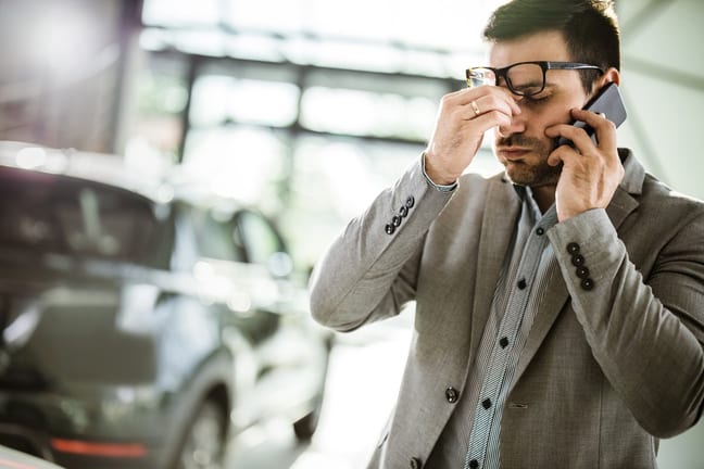Man in apparent distress on phone with vehicl.width .jpg