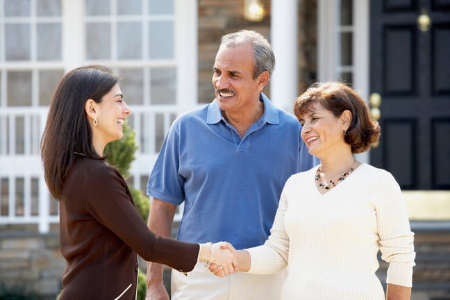 Realtor shaking hands with mature couple outs.width dGtEi.jpg