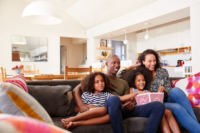family watching movie on couch.width .jpg
