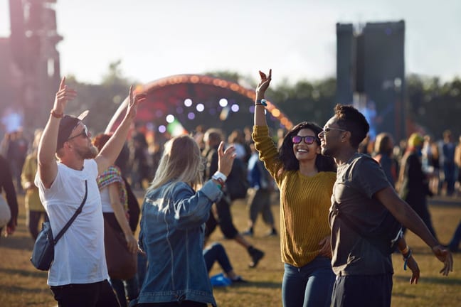 friends dancing at music festival sNvM.width .jpg