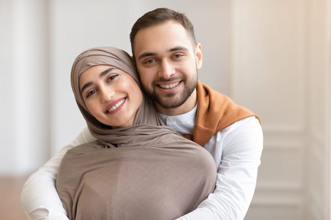 getty couple smiling embracing.jpg