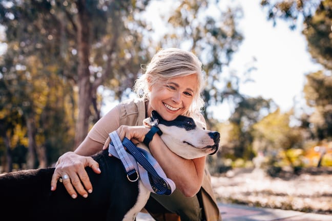getty happy with a dog smiling.jpg