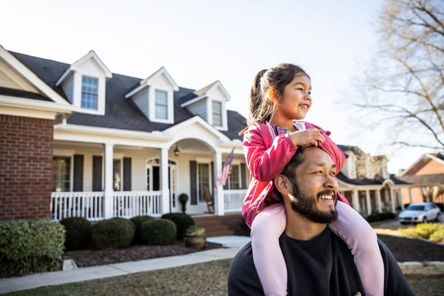 parent and child in front of house gnkEfq.width .jpg