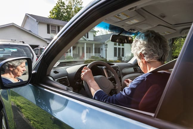 person driving car in front of house dLfSE.width .jpg