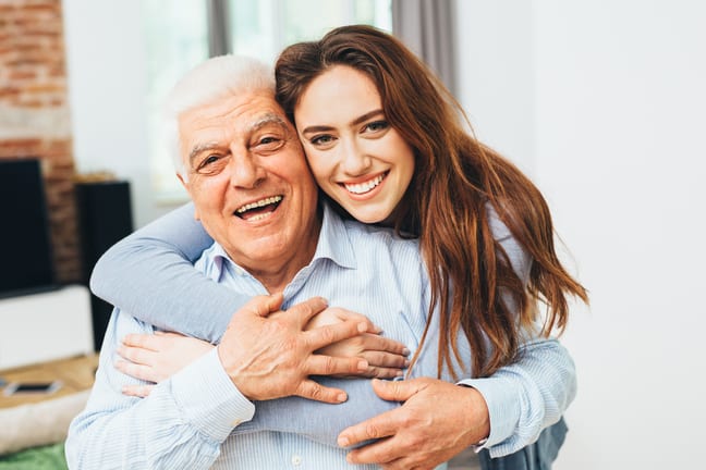 two smiling people with arms around each other gettyimages .jpg