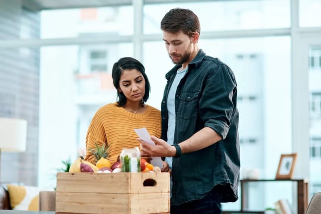Couple looking unhappy with receipt for their.width aJabEC.jpg