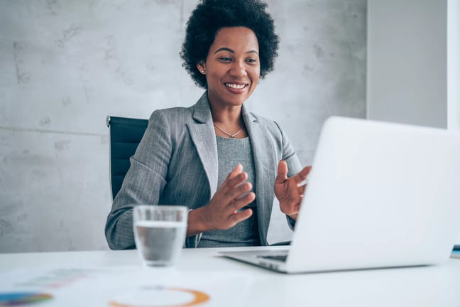 a person at a desk smiling.jpg