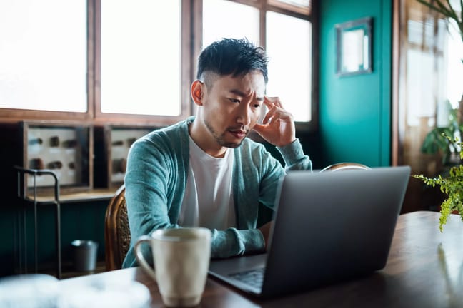 concerned unhappy person staring at laptop.jpg