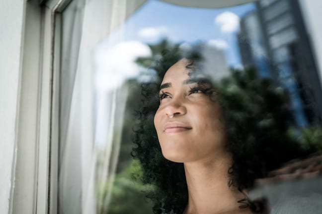 getty grateful thankful thinking smiling looking up.jpg