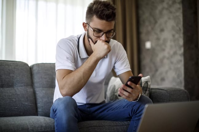 man s serious phone gettyimages .jpg