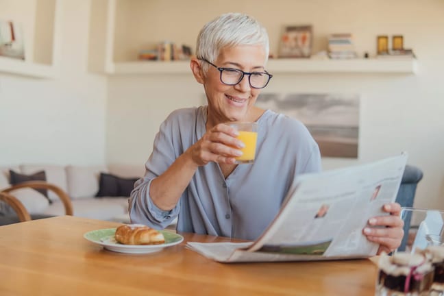 older woman newspaper gettyimages .jpg