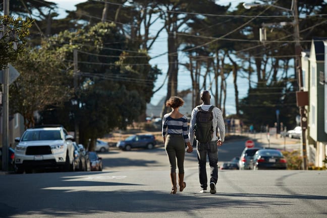 two people walking down street WdvM.width .jpg