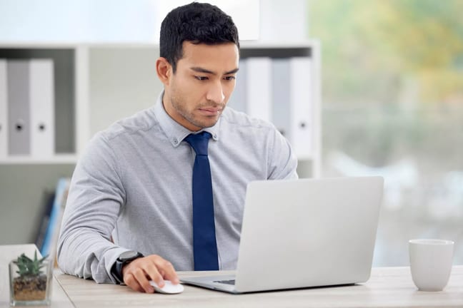 younger man at laptop serious gettyimages .jpg
