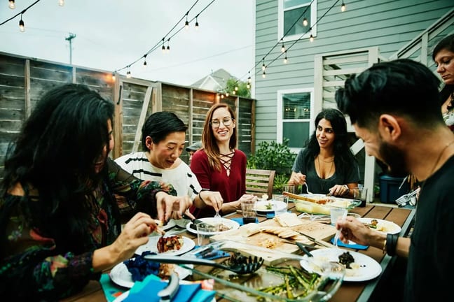 friends at backyard dinner party HUYIuZ.width .jpg