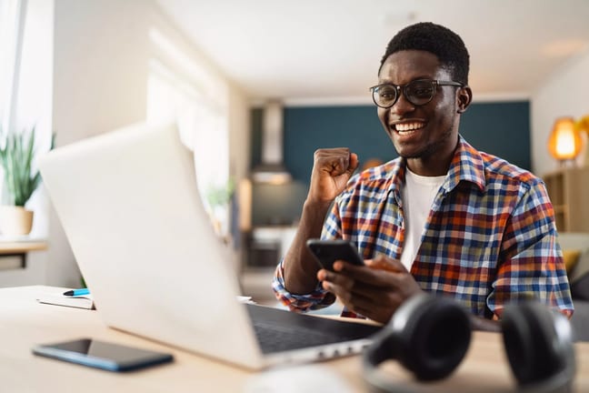man s laptop smiling gettyimages .jpg