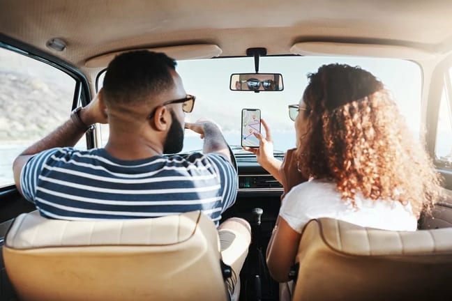 two people driving car HlRq.width .jpg