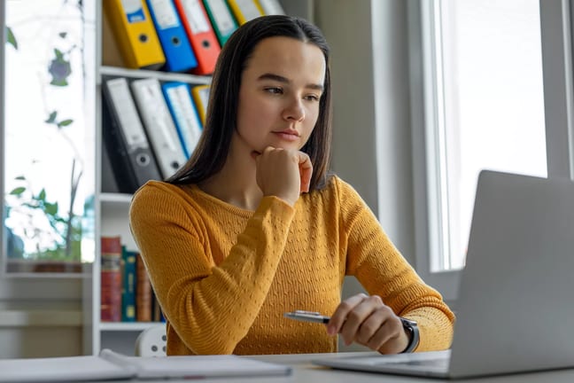 young woman looking at laptop.jpg