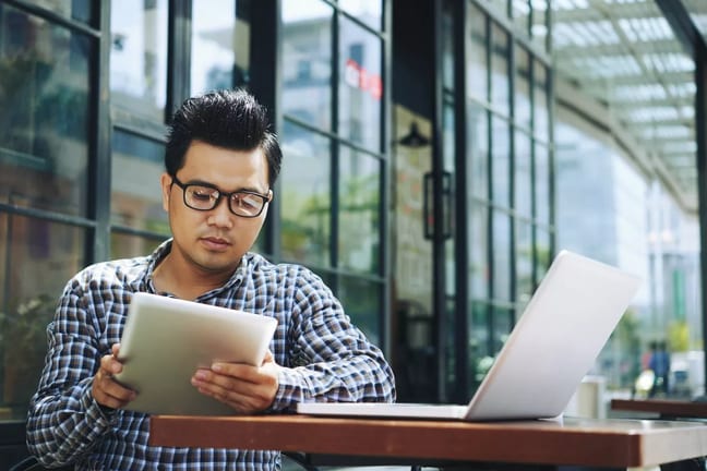 Man reading tablet jNq.width .jpg