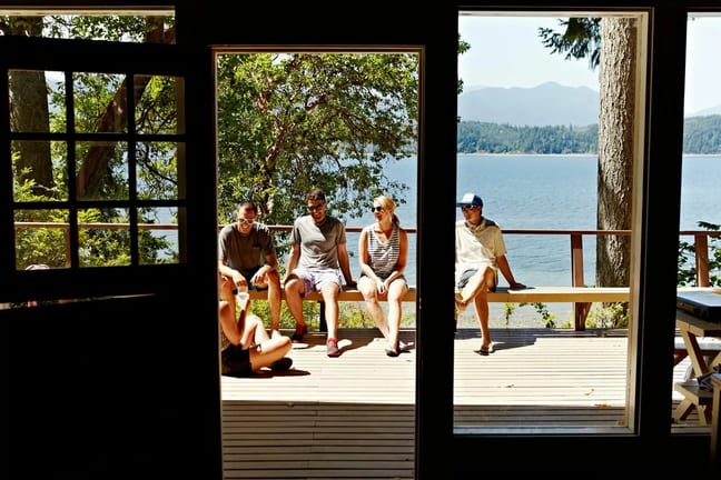 friends on deck of lake house sMCcwwu.width .jpg
