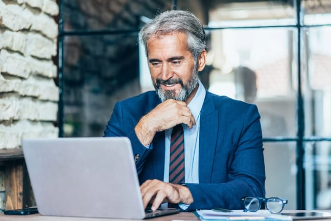man older business suit laptop gettyimages .jpg