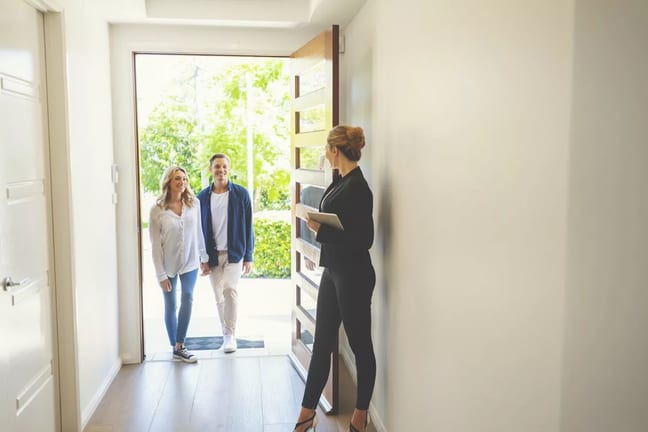 realtor and couple in home.width .jpg