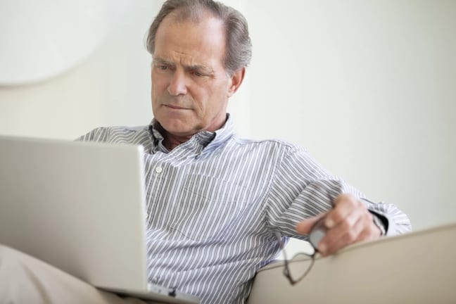 serious senior using laptop social security getty.jpg
