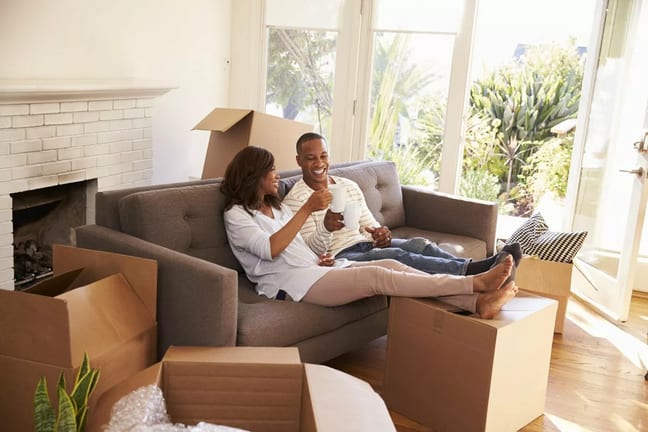 smiling couple toasting with coffee mugs on c.width oXOEFhv.jpg