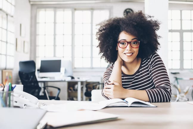 woman s smiling table gettyimages .jpg