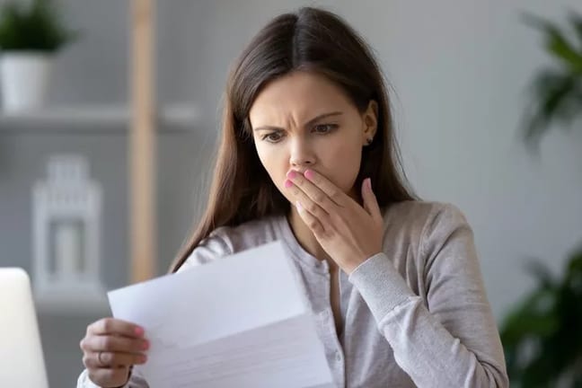 woman surprised at bill.width HBTG.jpg