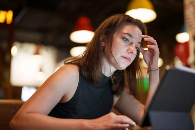young woman working on digital tablet.jpg