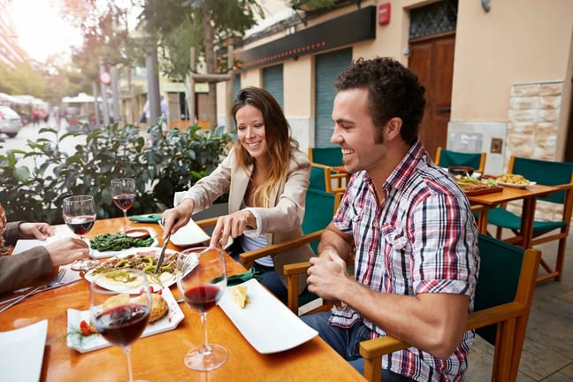 Couple sharing food at a european style resta.width VdwCA.jpg