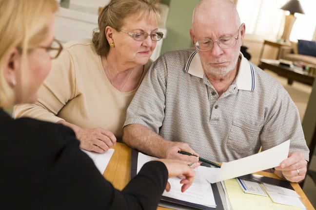 Older couple looking at paperwork DyGr.width .jpg