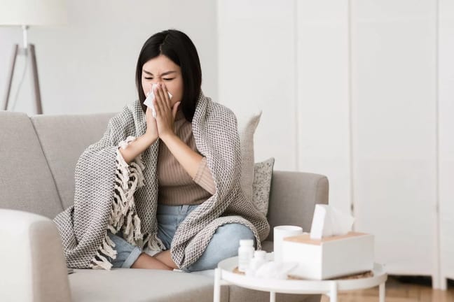 Sick woman blowing nose qBgNC.width .jpg