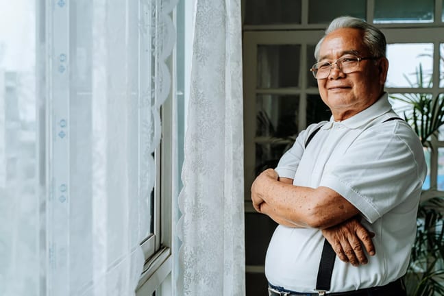 getty smiling senior with arms crossed.jpg