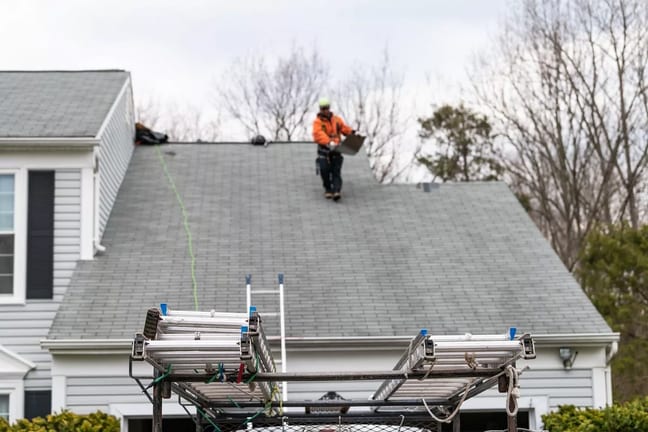 roofer on top of house oTuYRk.width .jpg