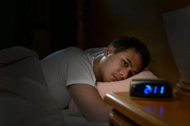 man in bed cant sleep WPiAsg.width .jpg