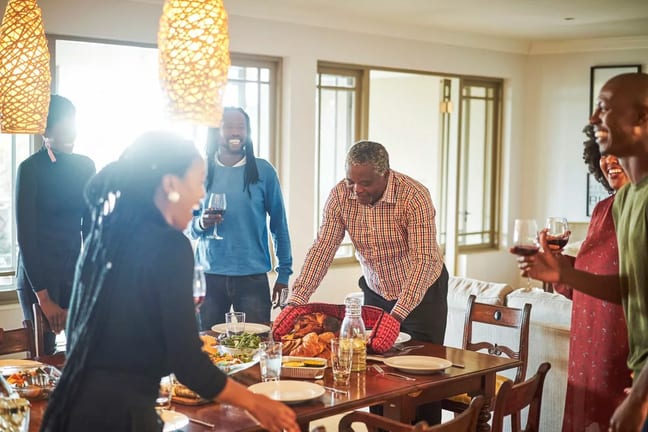 family at Thanksgiving table jIYUm.width .jpg