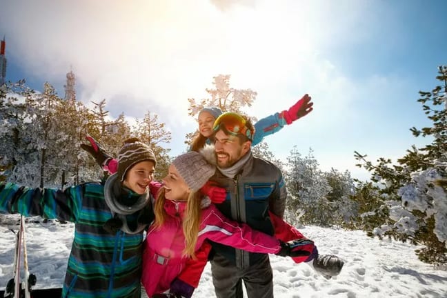 family skiing snowy mountain.width .jpg