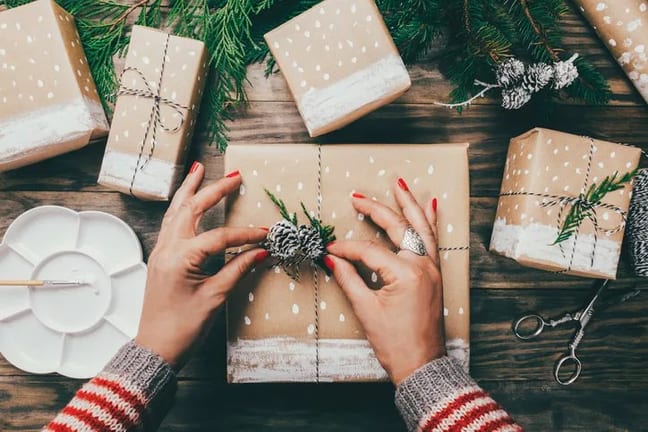 womans hands wrapping gifts.width .jpg